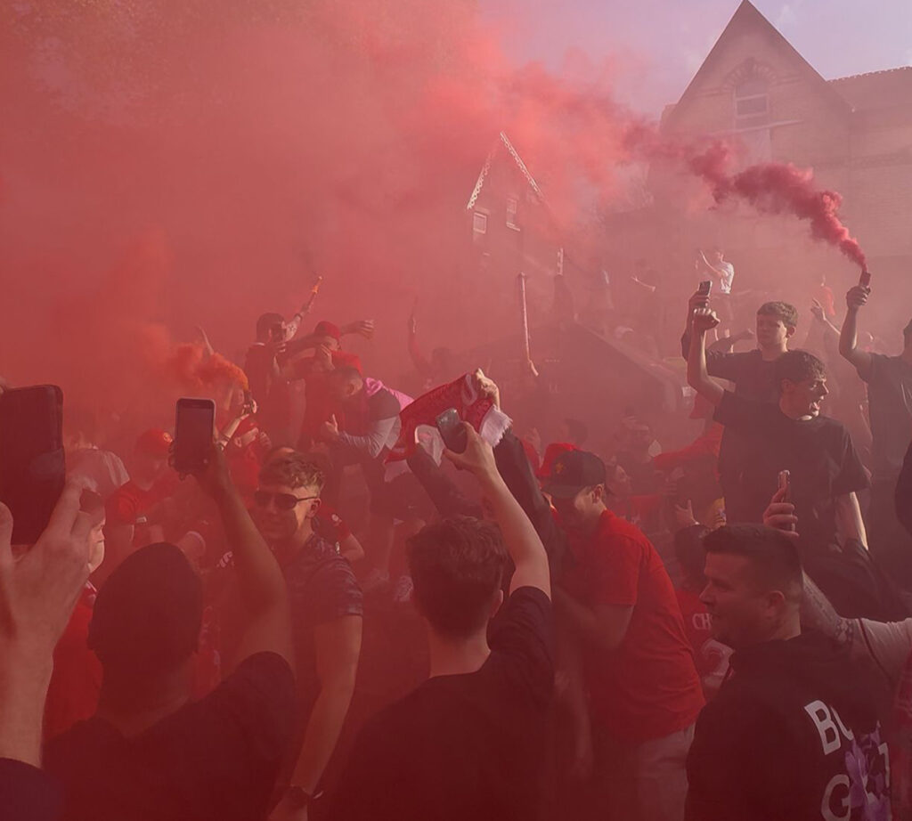 Liverpool FC Fans Celebrating at Hotel Anfield with Flares Steps away from Anfield Stadium